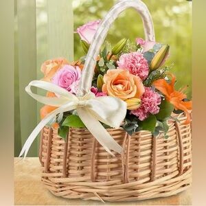 Tan and White Wicker Basket With a Ribbon Wrapped Handle